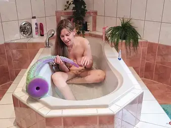 Observe this kinky teen's solo session with a massive tatted monster in the water